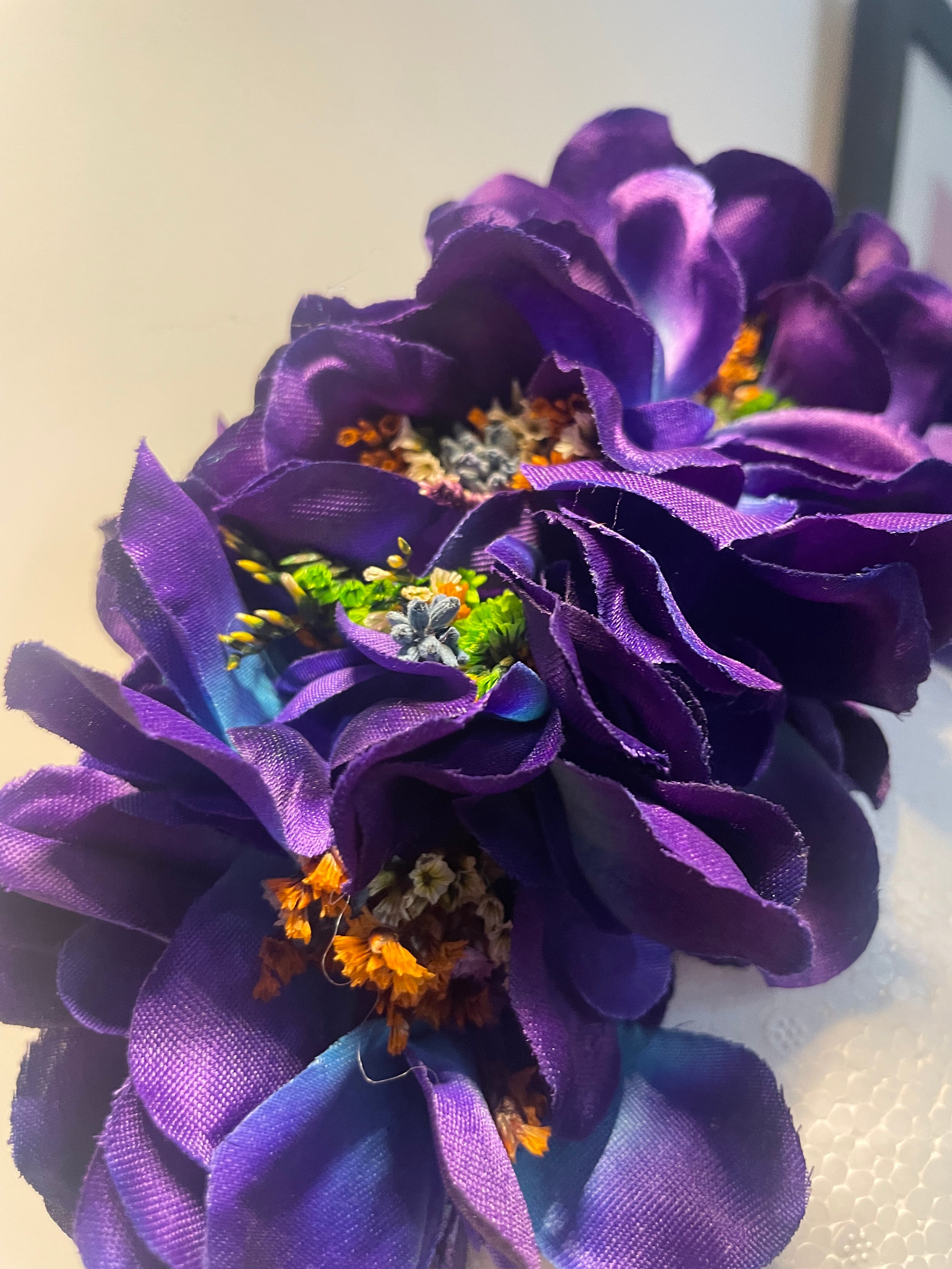 Blue/purple flowered headband inset with coloured dried flowers