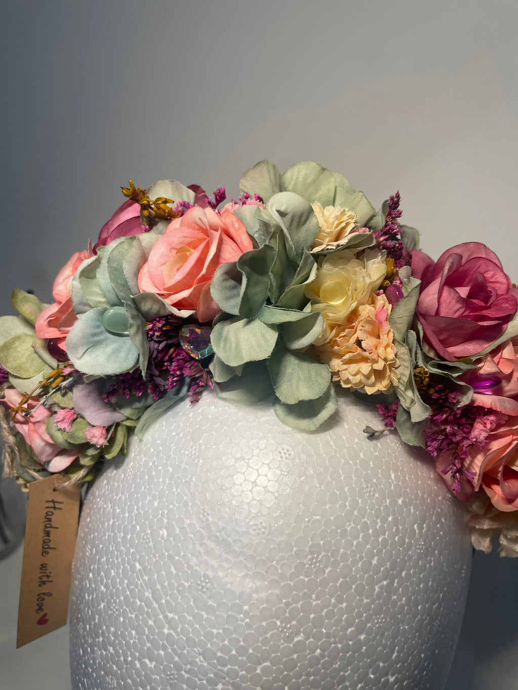 Gorgeous pink roses and green flowered headband